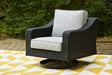 Beachcroft outdoor swivel lounge chair with black resin wicker and light gray cushion, front angle