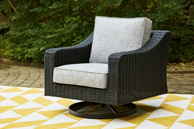 Beachcroft outdoor swivel lounge chair with black resin wicker and light gray cushion, front angle