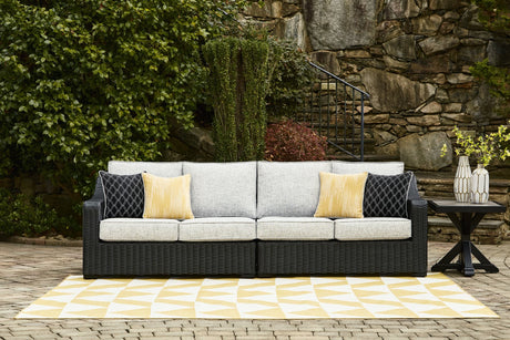 Beachcroft 2-piece outdoor loveseat black resin wicker light gray cushions front angle