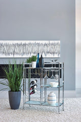 Derion chrome serving cart front view with glass shelves and caster wheels