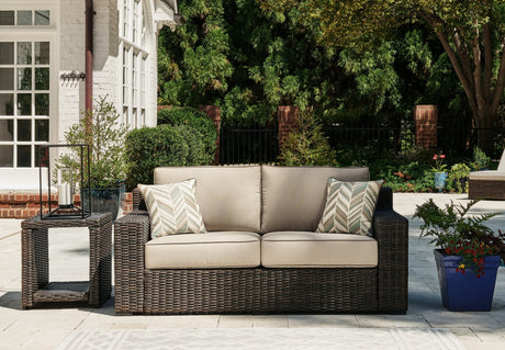 Coastline Bay Brown Outdoor Loveseat front angle with cushions