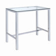 Tolbert bar table with chrome metal frame and clear glass top, angled view