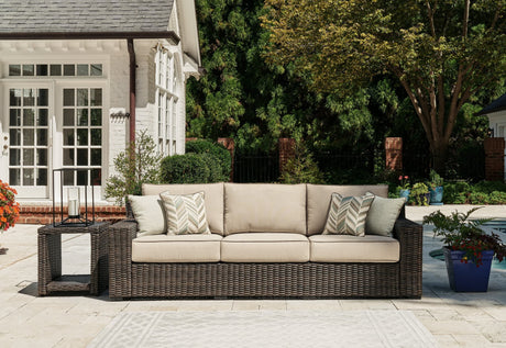 Coastline Bay brown outdoor sofa angled view