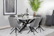 Paulita dining table with white ceramic top and gunmetal geometric base front view