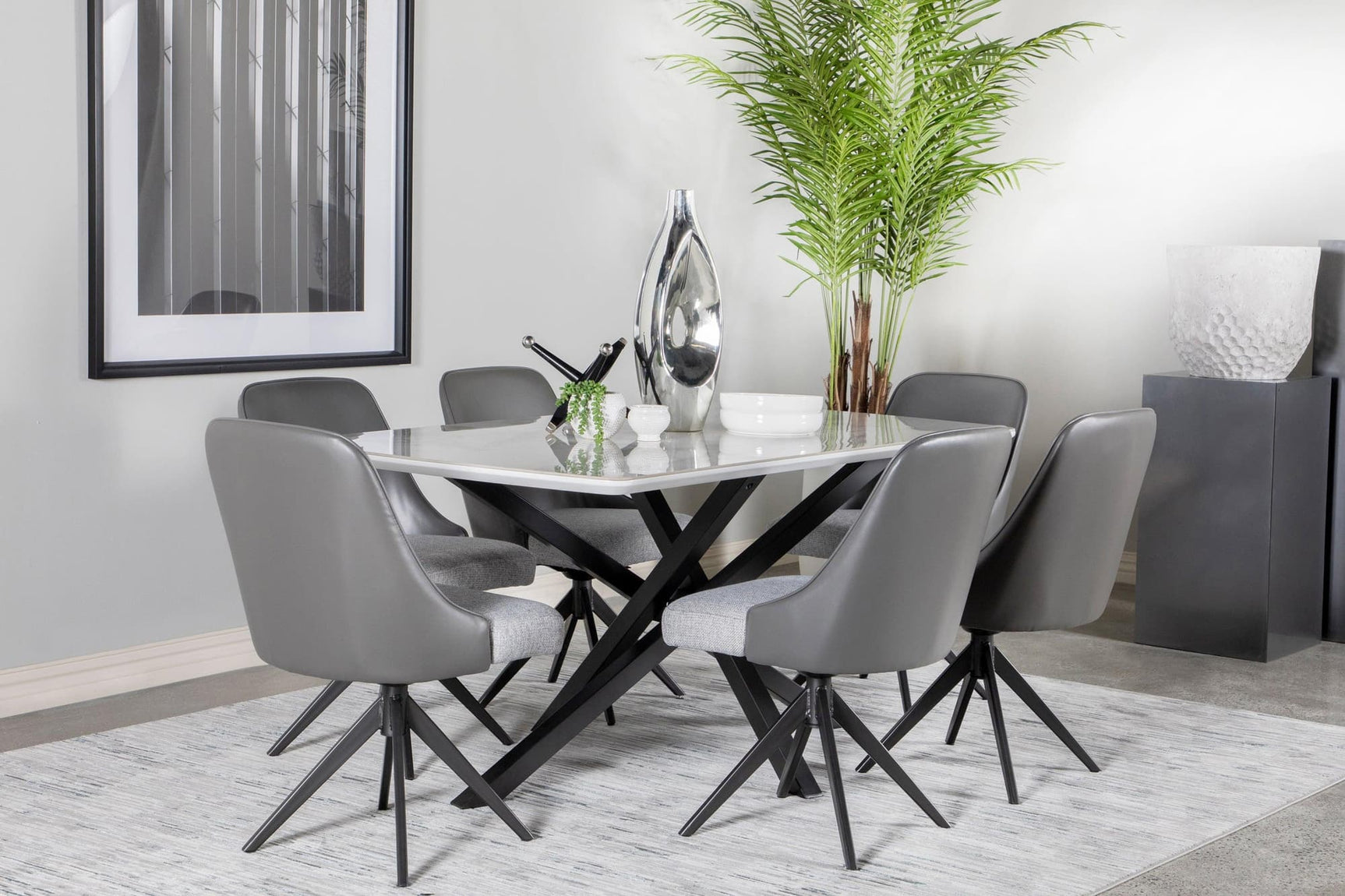 Paulita dining table with white ceramic top and gunmetal geometric base front view