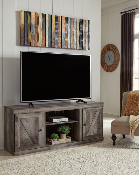 Wynnlow Gray Rustic solid wood TV stand with cabinet, angled front view