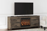 Trinell large brown rustic solid wood TV stand with fireplace and cabinet front view