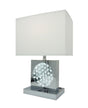 Orren Ellis chrome table lamp with tall glass shade