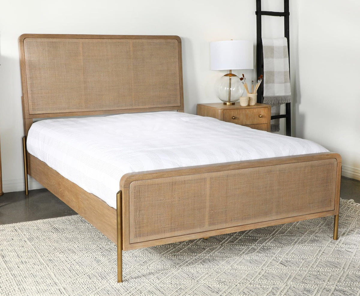 Arini Upholstered Eastern King Panel Bed front view showing sand wash finish and natural cane headboard
