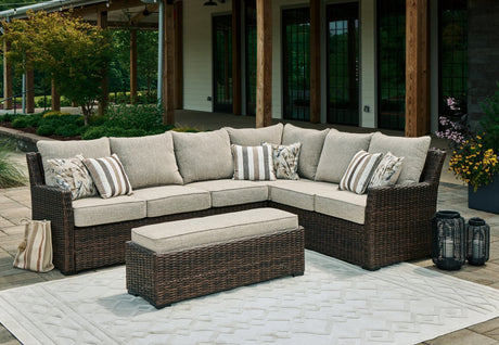 Brook Ranch brown outdoor sofa sectional and bench set with cushions, angled view