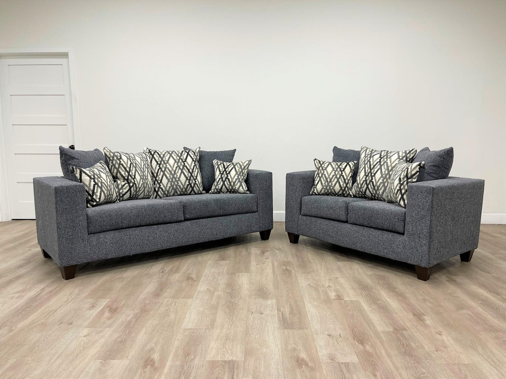 Steel gray fabric upholstered sofa front angle