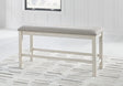 Robbinsdale antique white 49-inch counter height dining bench with light gray upholstered cushion, angled view