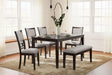 Langwest brown rectangular dining table with tapered legs, side angle view