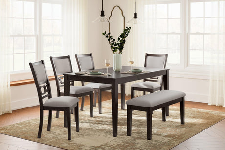 Langwest brown rectangular dining table with tapered legs, side angle view