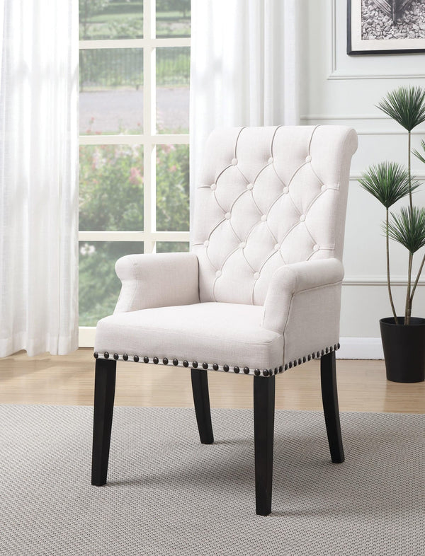 Alana beige upholstered dining chair with smokey black wooden legs, angled view