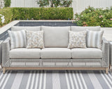 Seton Creek gray outdoor sofa with cushions front angle