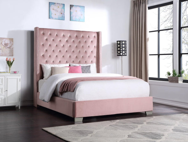 Pink velvet upholstered tufted king bed with 6ft tall headboard, angled view