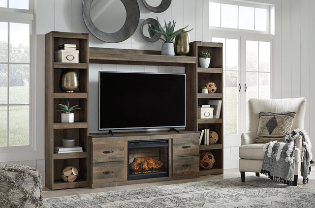 Trinell Brown 4-Piece Entertainment Center front view showing electric fireplace and TV stand