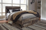 Derekson Multi Gray Queen Panel Bed front view showing headboard and storage drawers
