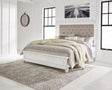 Kanwyn Whitewash Queen Upholstered Panel Bed front angle view