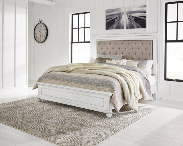 Kanwyn Whitewash Queen Upholstered Panel Bed front angle view