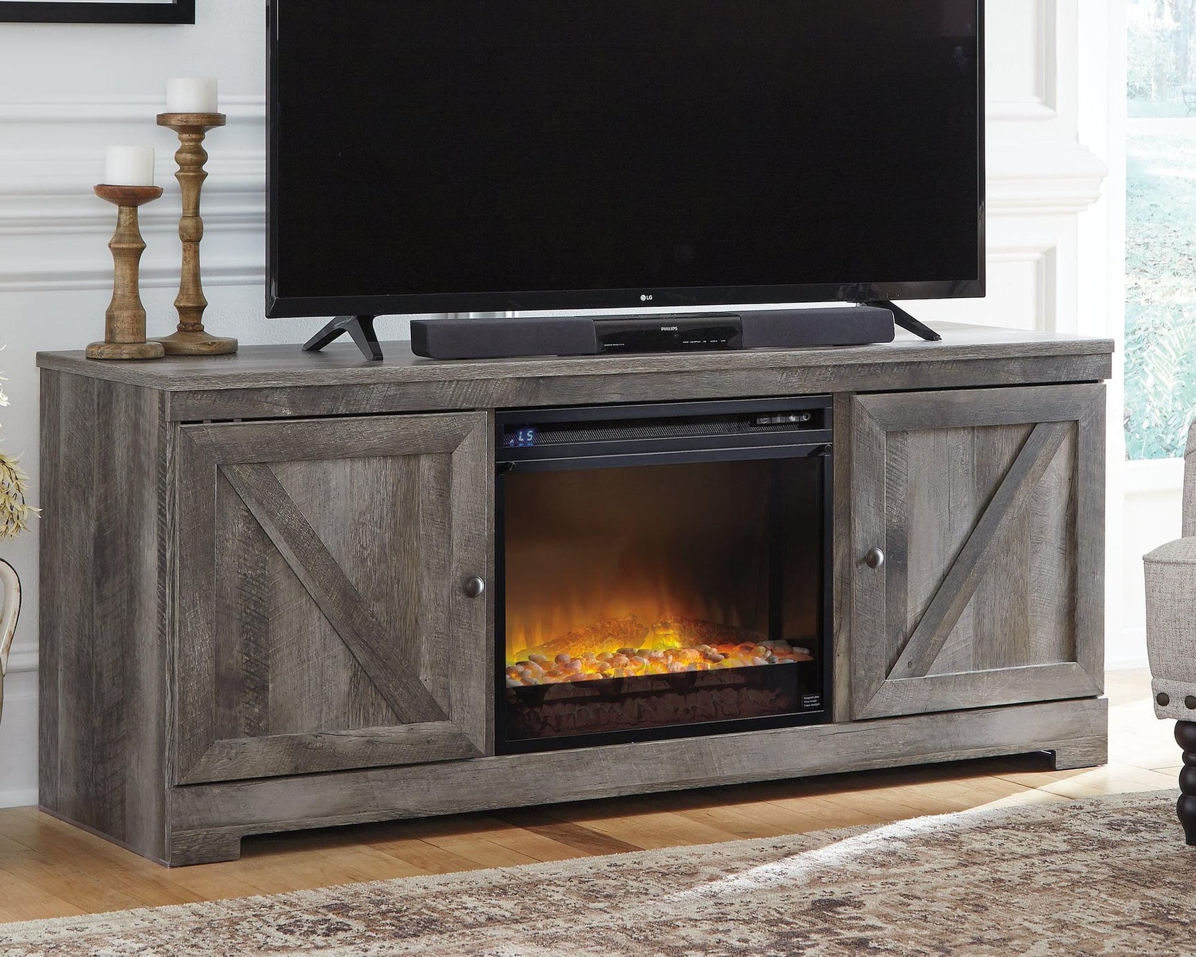 Wynnlow Gray 63 inch TV Stand with electric fireplace angled view