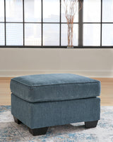 Cashton Blue Chenille Ottoman angled view showing upholstery texture