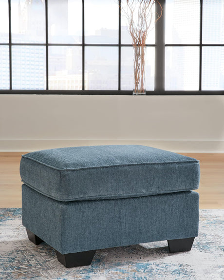 Cashton Blue Chenille Ottoman angled view showing upholstery texture
