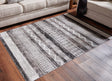 Henchester 5' x 7' multi-color patterned area rug laid flat
