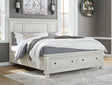 Robbinsdale Antique White Queen Panel Storage Bed angled side view