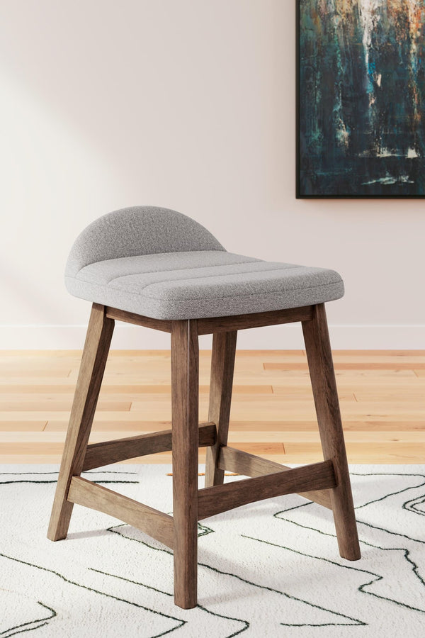 Lyncott counter height bar stool side view showing light gray upholstered seat and brown wood frame