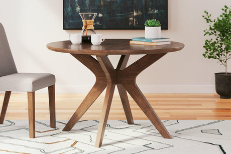 Lyncott dining table angled view medium brown finish