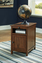 Treytown Brown Chairside End Table angled front view with door closed