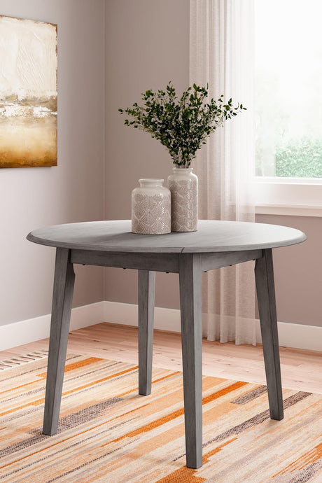 Shullden Gray Drop Leaf Dining Table by Ashley – angled side view showing dining surface