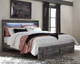 Baystorm gray king panel bed front view with headboard and storage drawers