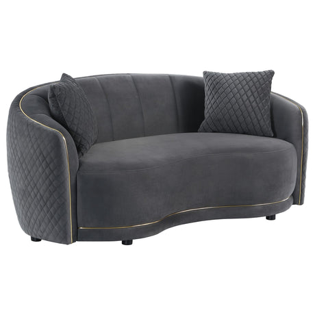 Brookside velvet upholstered curved loveseat in dark grey showing front angle