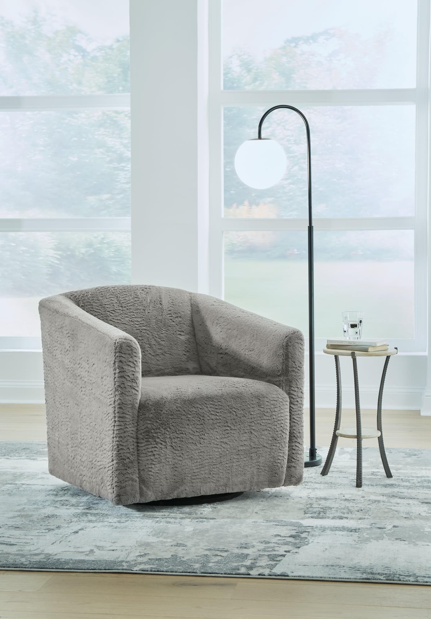 Bramner Charcoal Swivel Accent Chair angled side view