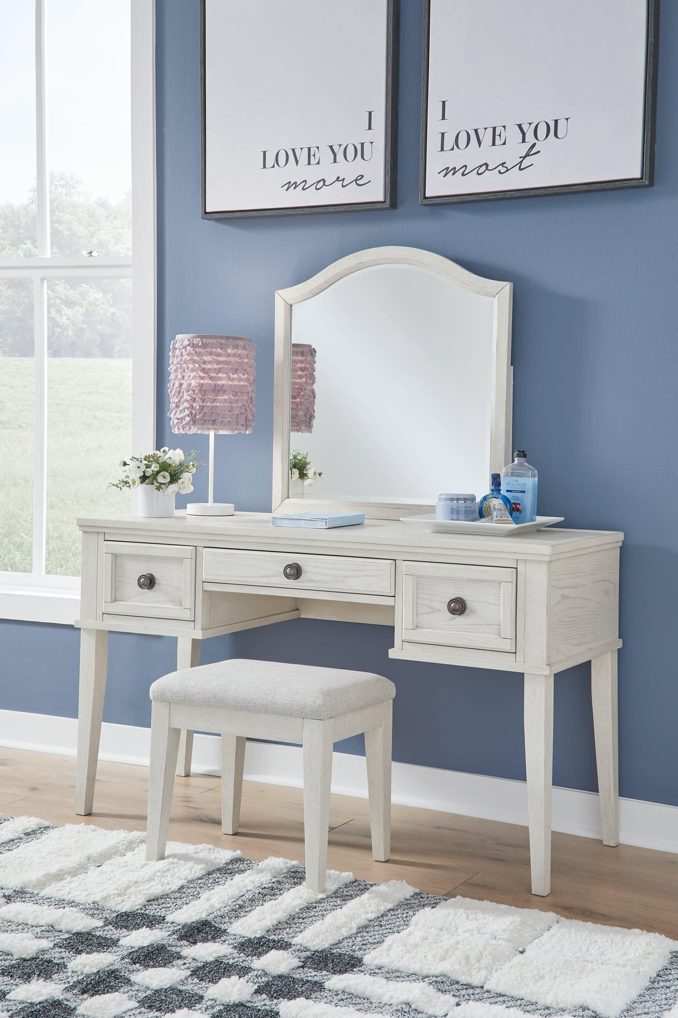Robbinsdale antique white mirrored vanity with cushioned bench front angle
