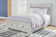 Robbinsdale Antique White Full Sleigh Storage Bed angled view