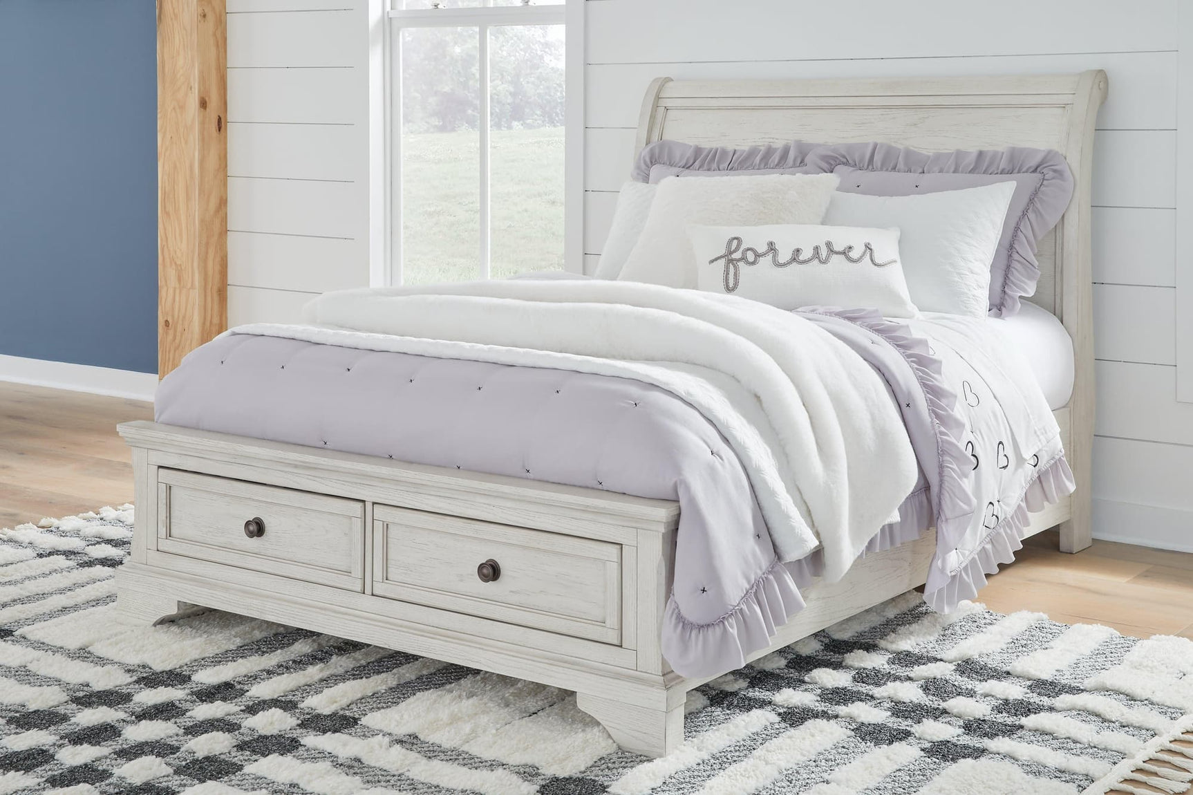 Robbinsdale Antique White Full Sleigh Storage Bed angled view