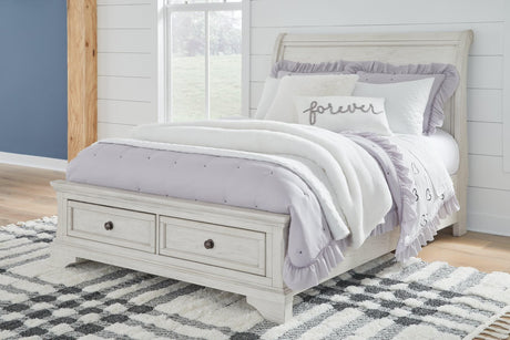 Robbinsdale Antique White Full Sleigh Storage Bed angled view