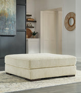 Ivory velvet oversized accent ottoman angled view