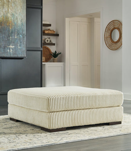 Ivory velvet oversized accent ottoman angled view