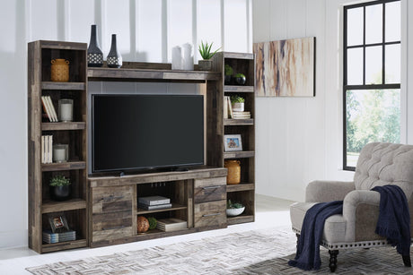 Derekson Multi Gray 4-Piece Entertainment Center front view in living room