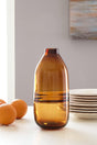 Lemmitt Amber Vase front view showing round shape and amber glass