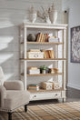 Realyn White Brown Bookcase front view