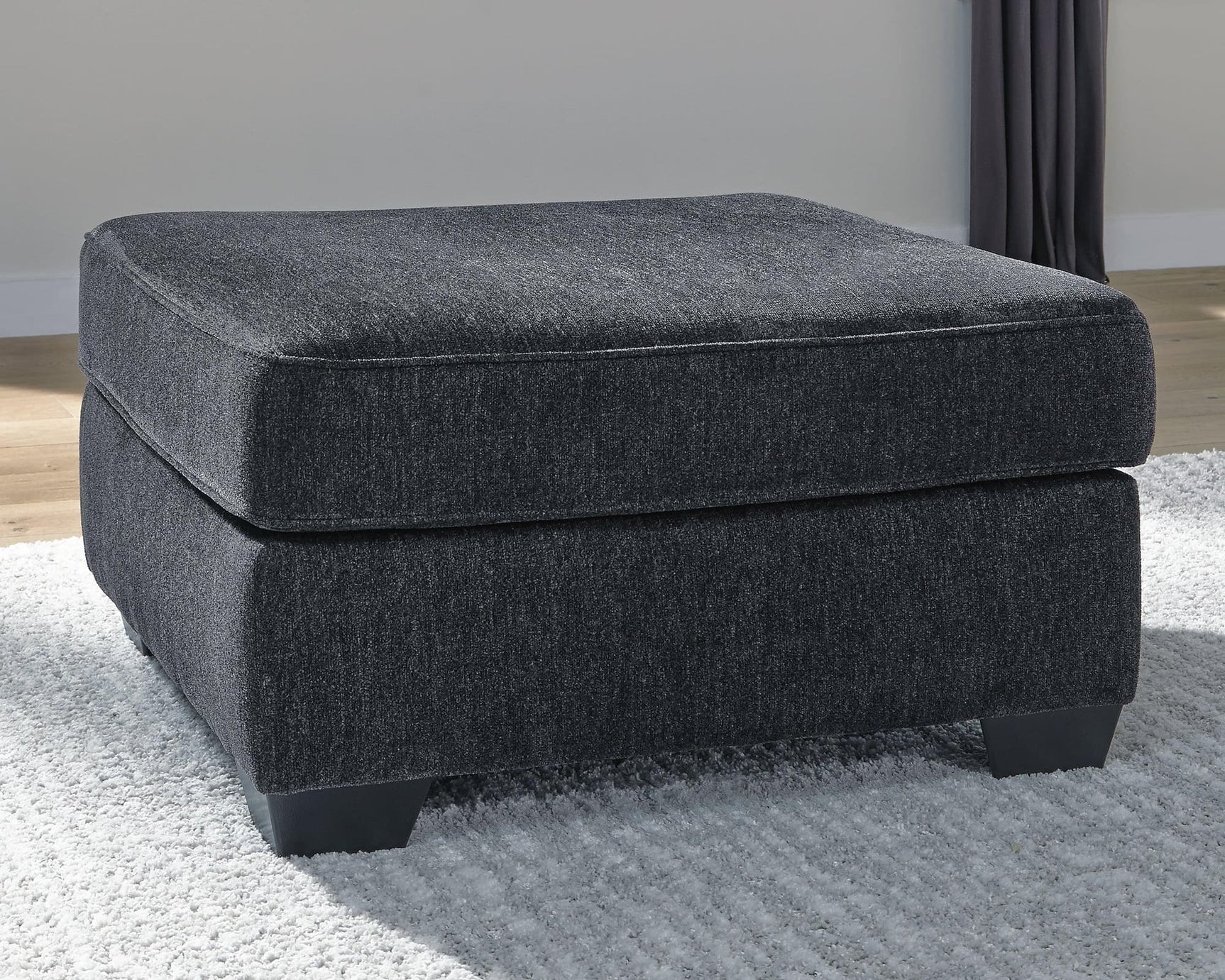 Altari Slate Chenille Oversized Accent Ottoman angled view showing slate fabric and exposed faux wood feet
