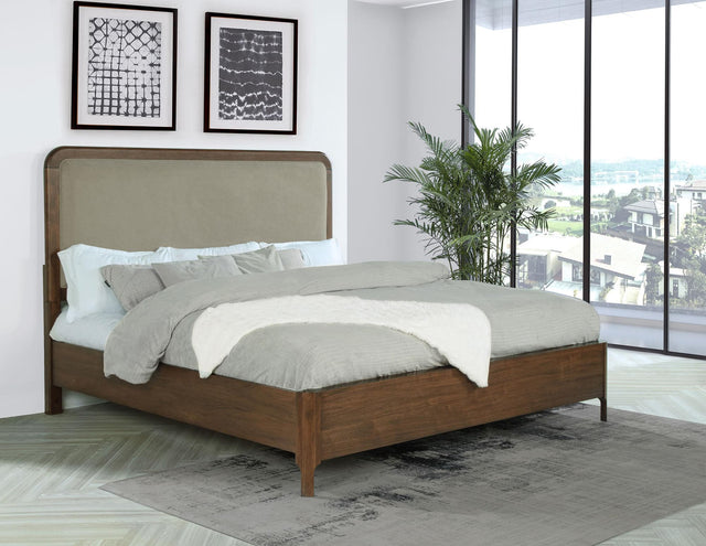 Front view of Maderia 57-inch Upholstered Eastern King Panel Bed in walnut