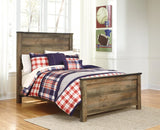 Trinell Brown Full Panel Bed front view showing headboard and nailhead trim