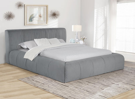 Wilshire Upholstered Eastern King Platform Bed in grey, angled side view